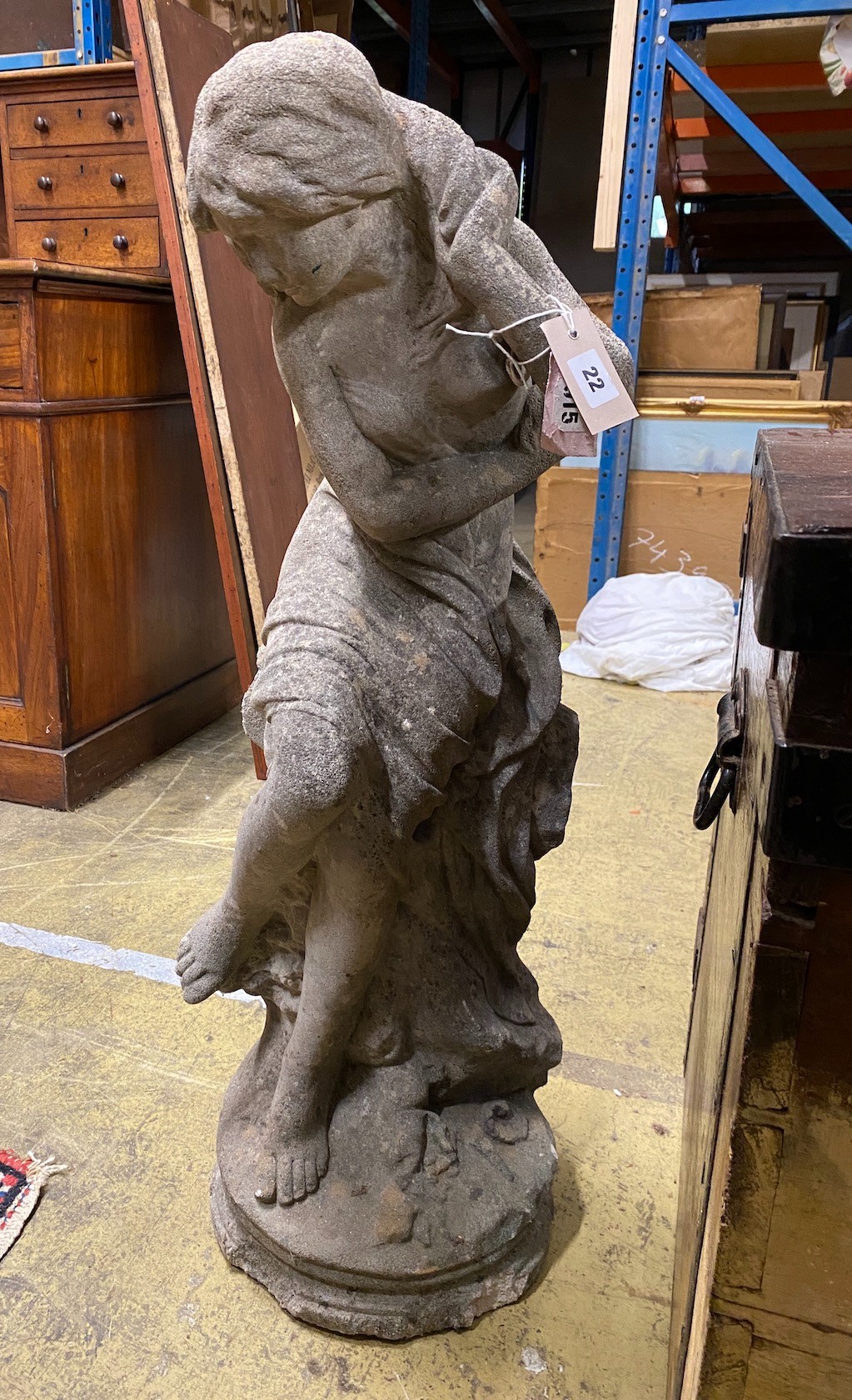 A reconstituted stone garden ornament of a female bather, height 84cm